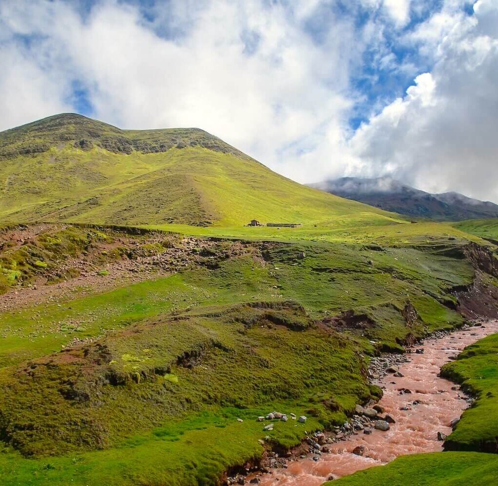 Red River near Palccoyo Rainbow Mountain during rainy season in Cusco Peru Andes